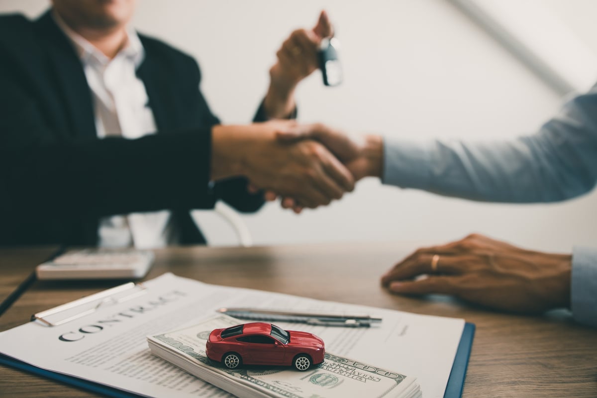 Salesman Giving Car's Key